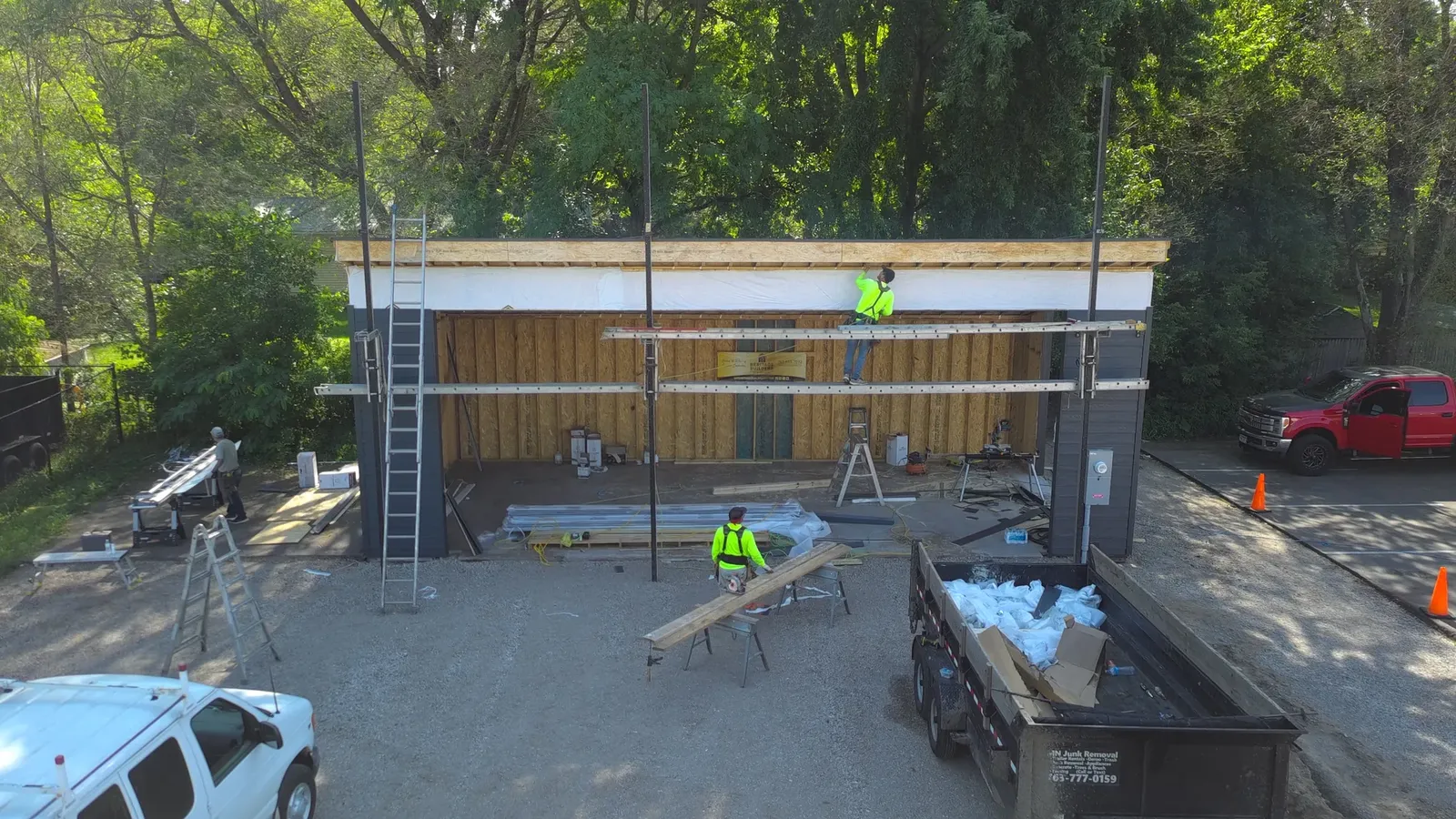 Aerial front view of roofing and exterior work in progress at The Hideout