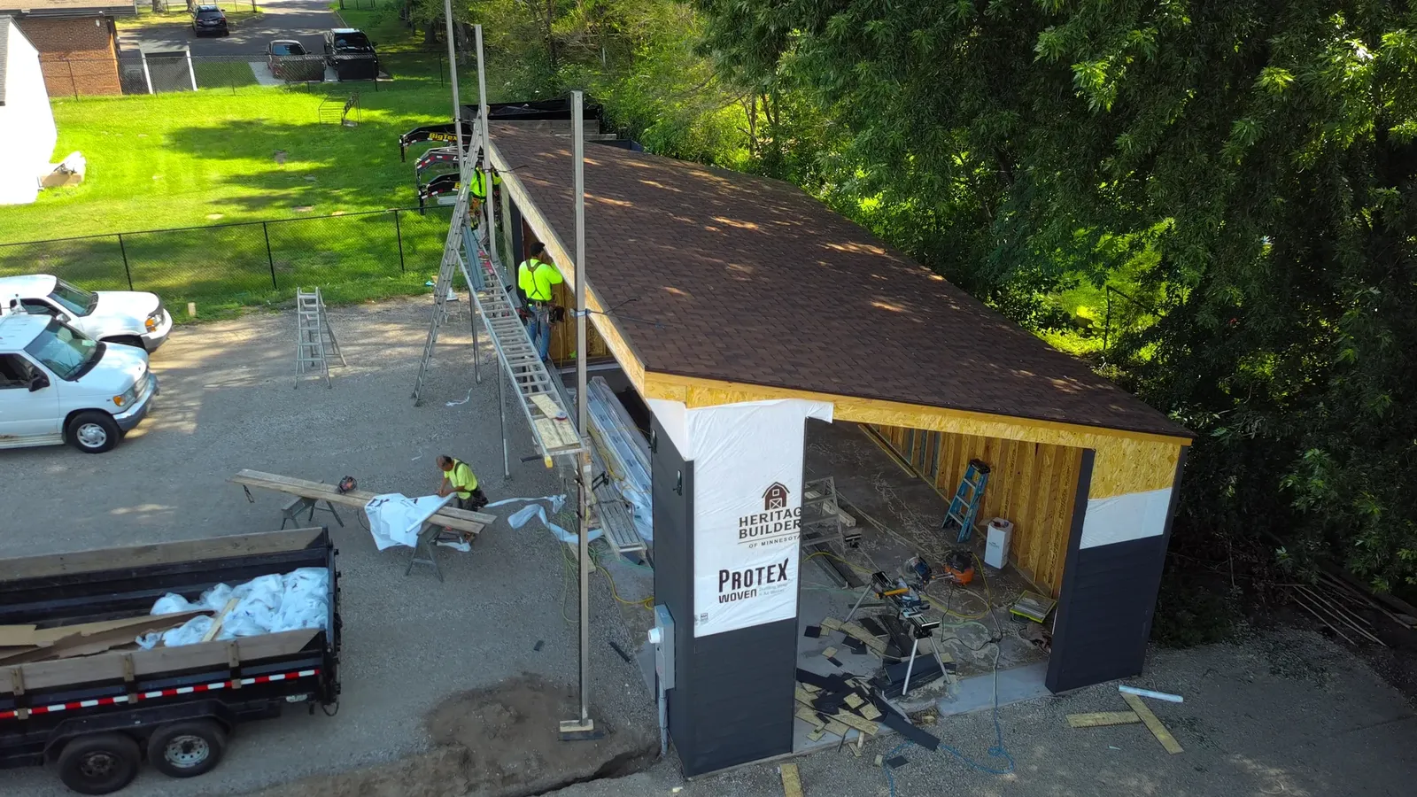 Aerial side view of roofing and exterior work in progress at The Hideout