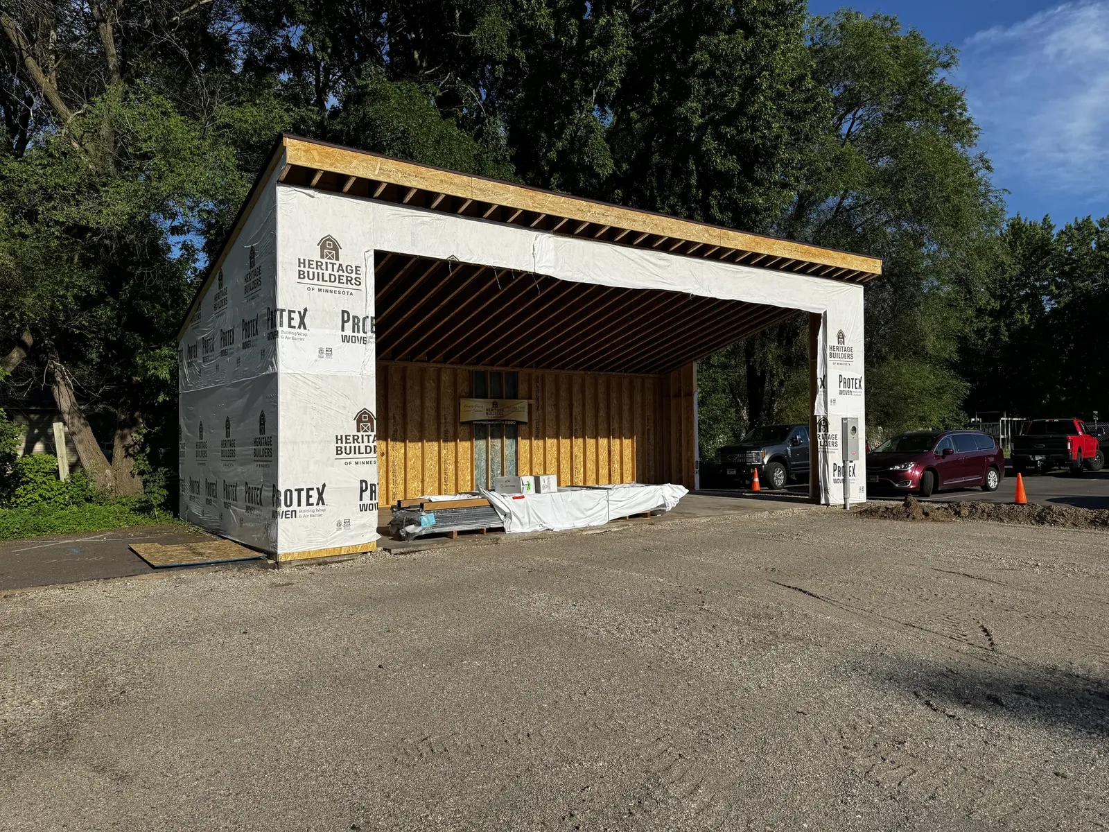 Angled view of The Hideout shell with housewrap and open stage bay