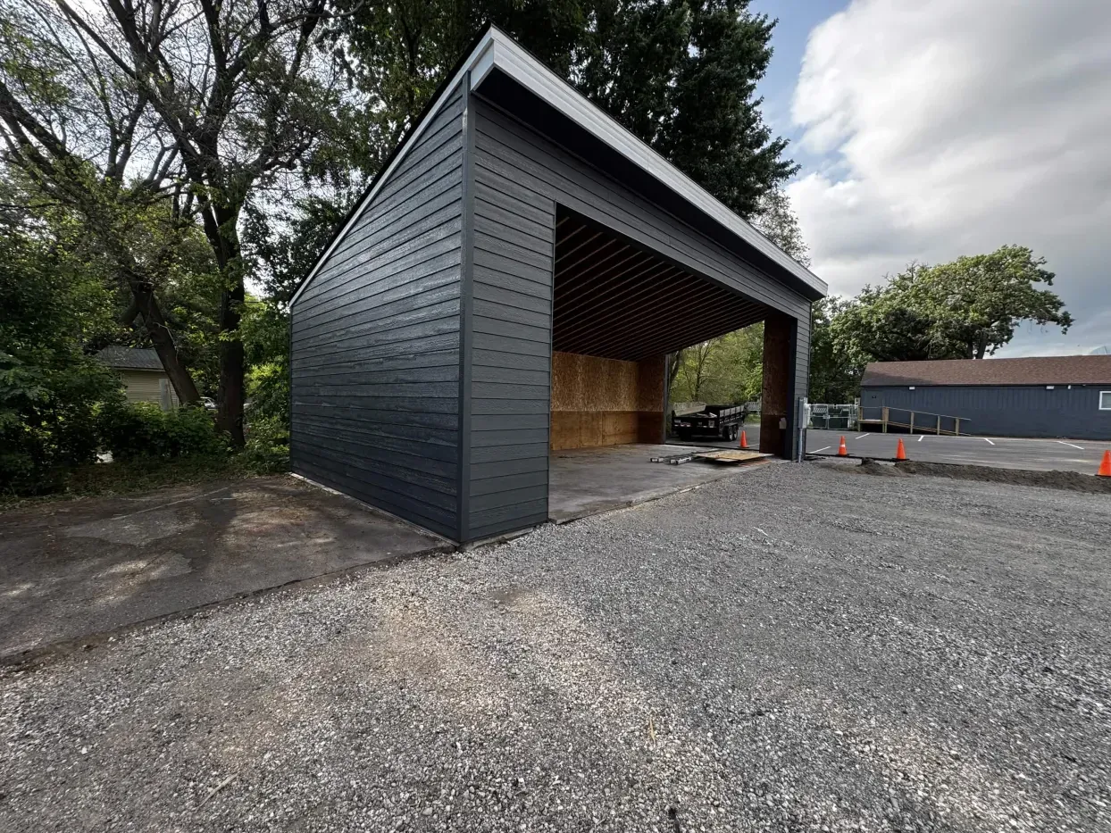 Exterior siding and roofline progress at The Hideout viewed from an angle