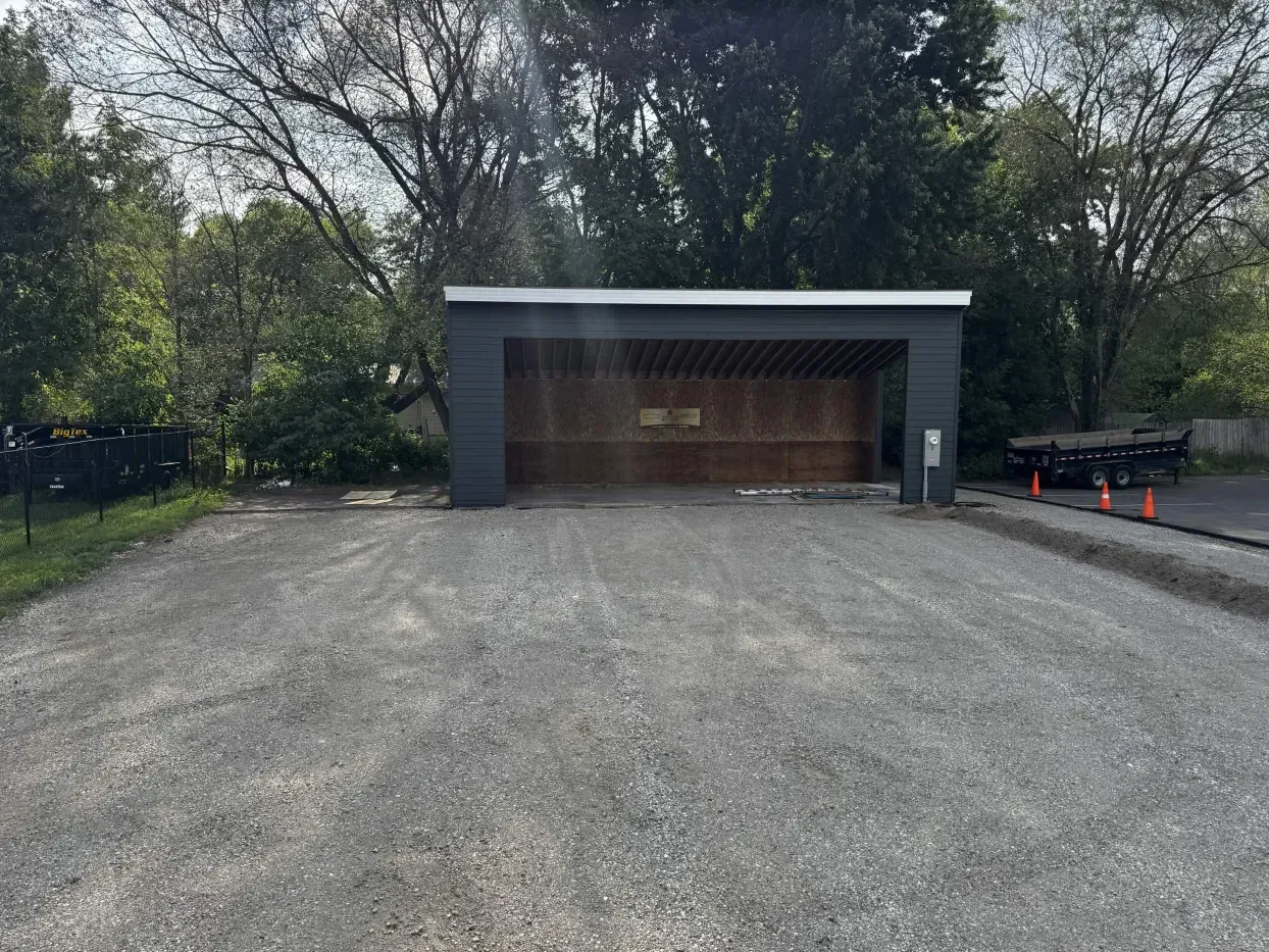 Front view of siding and roofline progress at The Hideout