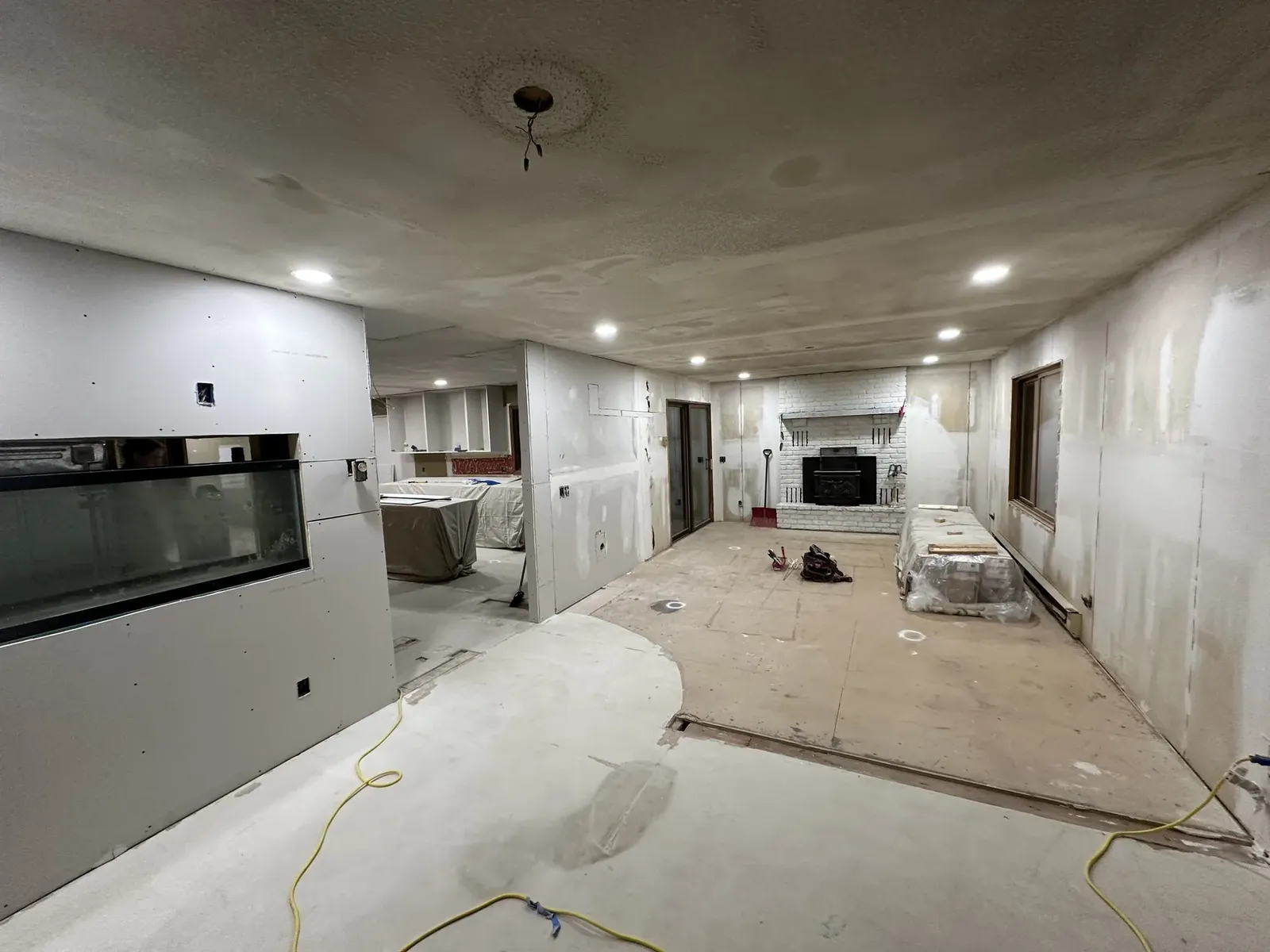 Wide interior remodel with drywall and finish work in progress